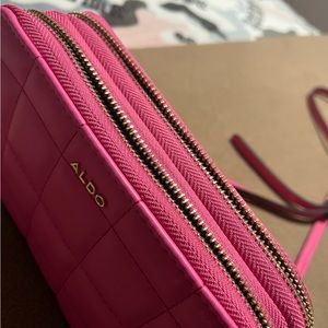 Aldo shoulder bag neon pink with gold settings.